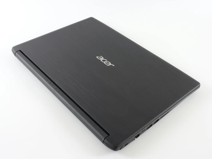 a laptop computer sitting on top of a white table